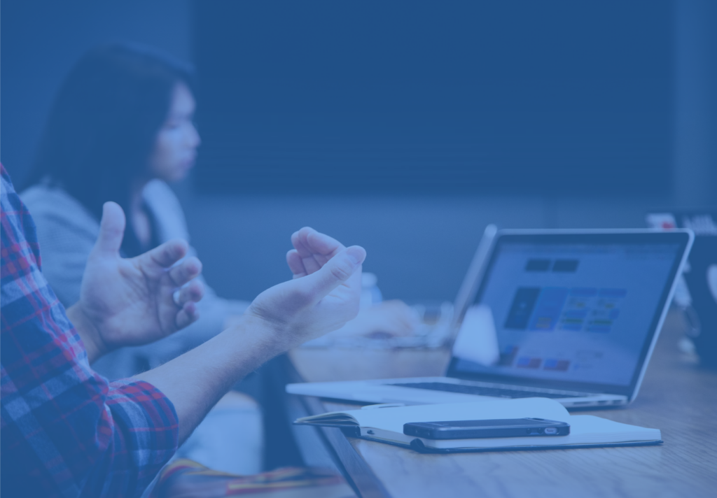 Closeup Of A Person Talking In Front Of A Laptop